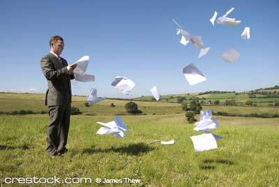 Business concept with paperwork flying everywh...