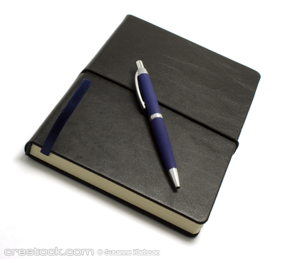 Black notebook with blue pen isolated on white