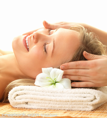 Day spa massaging and relaxation - a happy wom...